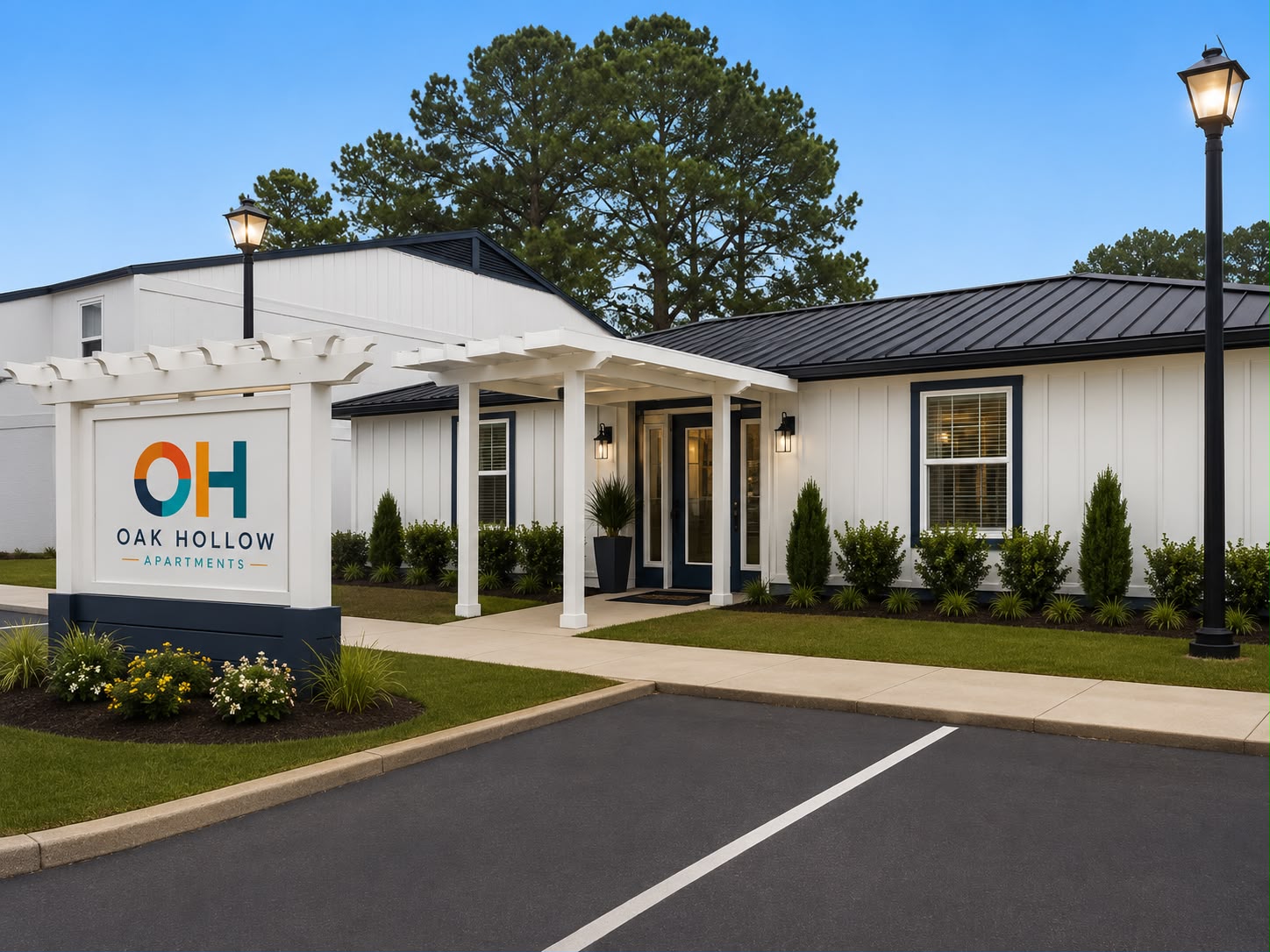 Oak Hollow Apartments leasing office exterior at dusk